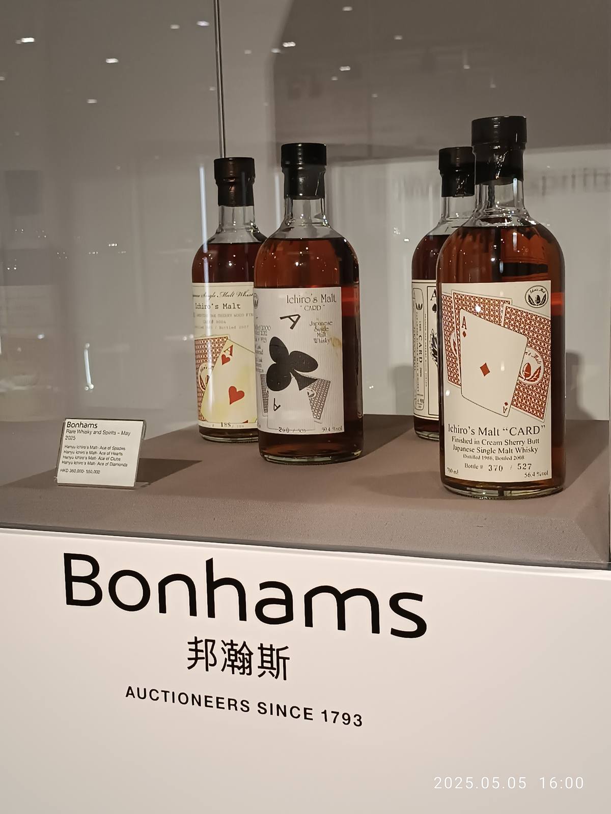 Fine wine bottles on preview at a Bonhams auction in Hong Kong. Liv-ex says secondary-market prices are back to 2015 levels, with back-vintage Bordeaux flagged as a key opportunity.